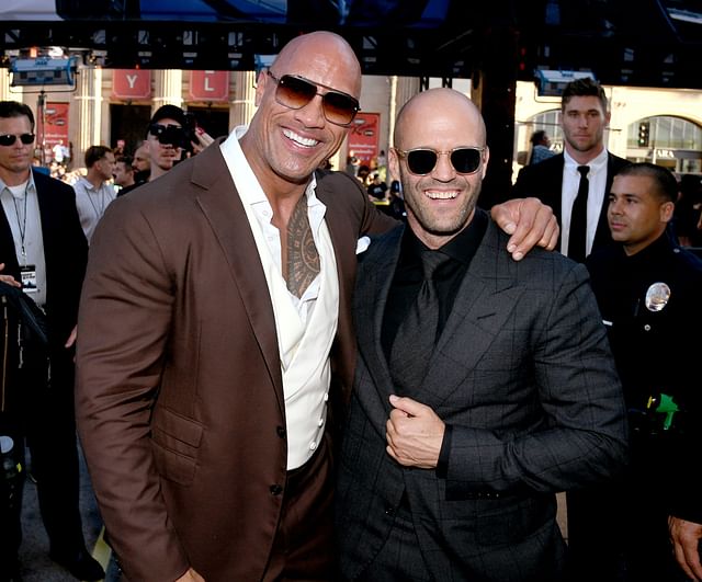 in this file photo taken on 14 july, 2019 dwayne johnson (l) and