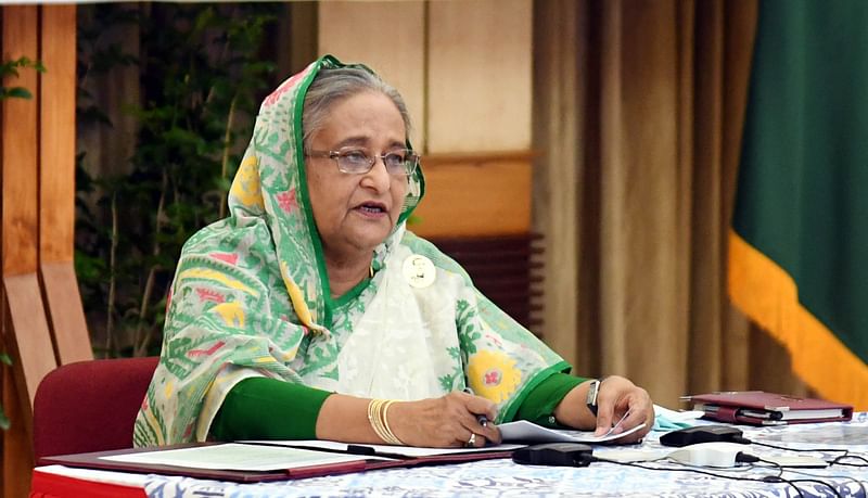 Prime minister Sheikh Hasina talks in a video conference with the officials of 64 districts from her official Ganabhaban residence in Dhaka on 31 March 2020.