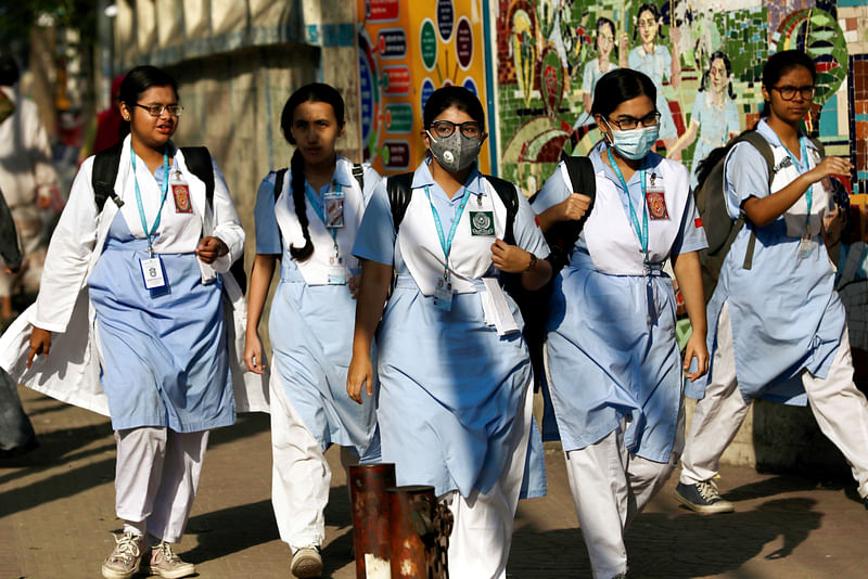 School girls wear masks as a protective measure after the first reported case of coronavirus in Dhaka, Bangladesh on 10 March 2020.