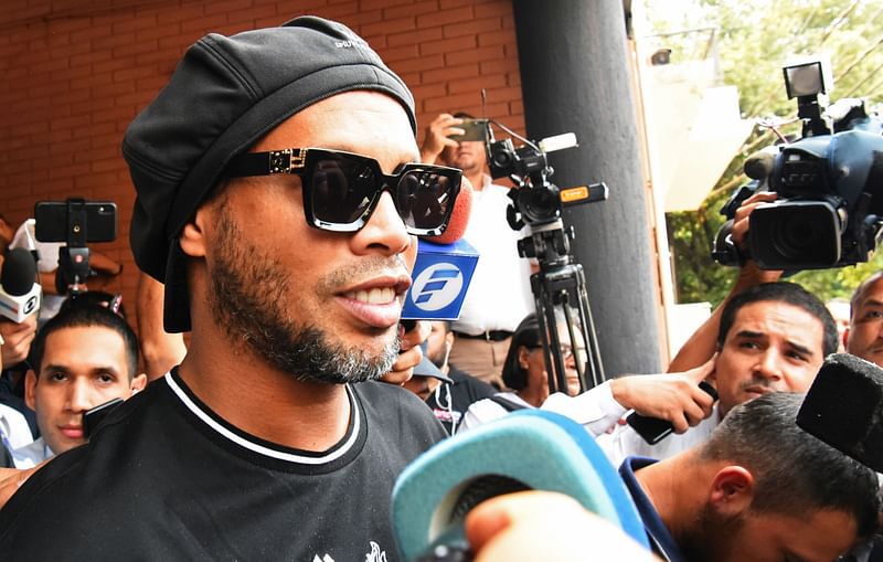 Brazilian retired football player Ronaldinho leaves Asuncion's Prosecution after declaring about his irregular entry to the country, in Asuncion, Paraguay, on 5 March 2020