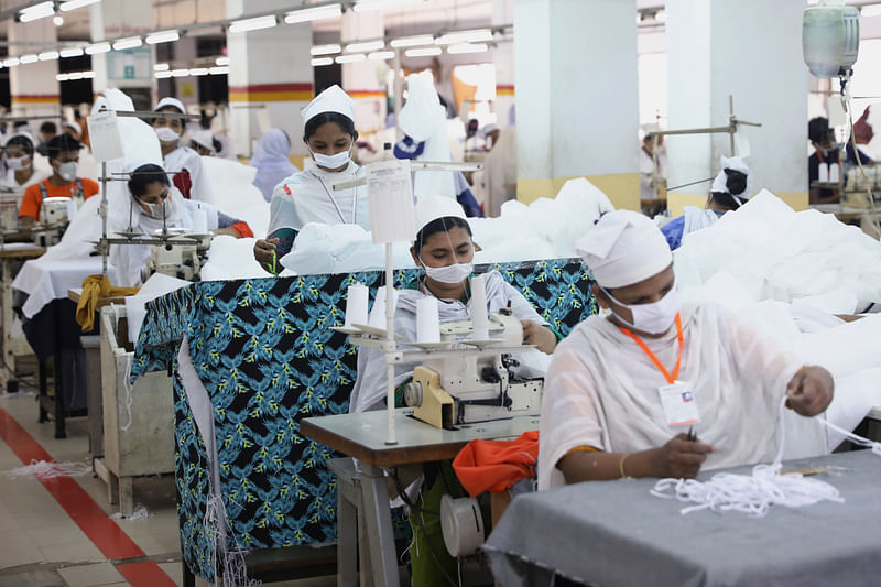 Bangladeshi garment workers make protective suit at a factory amid concerns over the spread of the coronavirus disease (Covid-19) in Dhaka, Bangladesh, on 31 March 2020