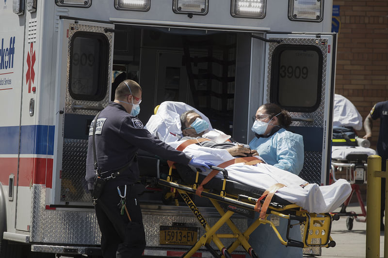 A patient is wheeled from Wyckoff Heights Medical Center to an ambulance as the coronavirus (COVID-19) pandemic continues in Brooklyn New York.