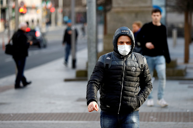 A man wearing a face mask on St. Patrick's Day as public events were cancelled as the number of coronavirus cases grow around the world, in Dublin, Ireland on 17 March.