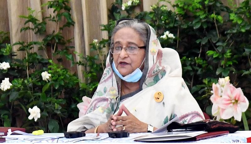 Prime minister Sheikh Hasina addresses a videoconferencing with public representatives and officials in Khulna and Barisal divisions from her official Ganabhaban residence in Dhaka on 12 April 2020