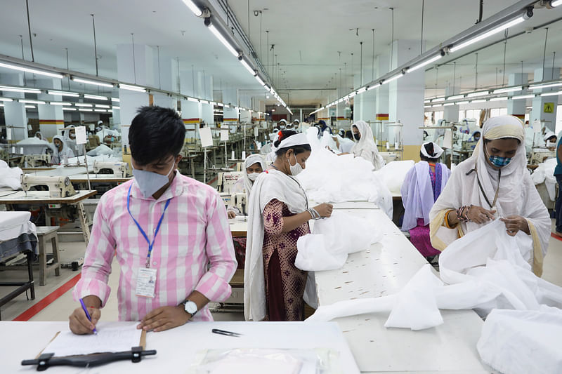 Bangladeshi garment workers make protective suit at a factory amid concerns over the spread of the coronavirus disease (COVID-19) in Dhaka, Bangladesh, on 31 March 2020