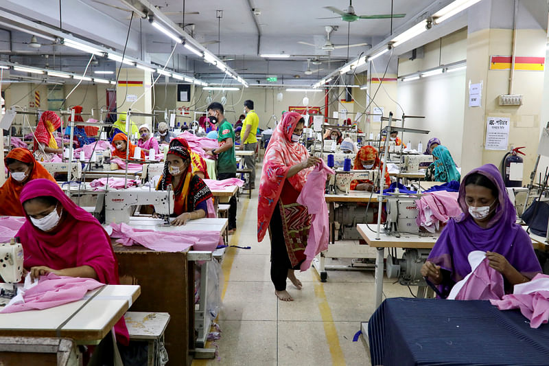 Women work in a garment factory, as factories reopened after the government has eased the restrictions amid concerns over coronavirus disease (COVID-19) outbreak in Dhaka, Bangladesh, on 3 May 2020