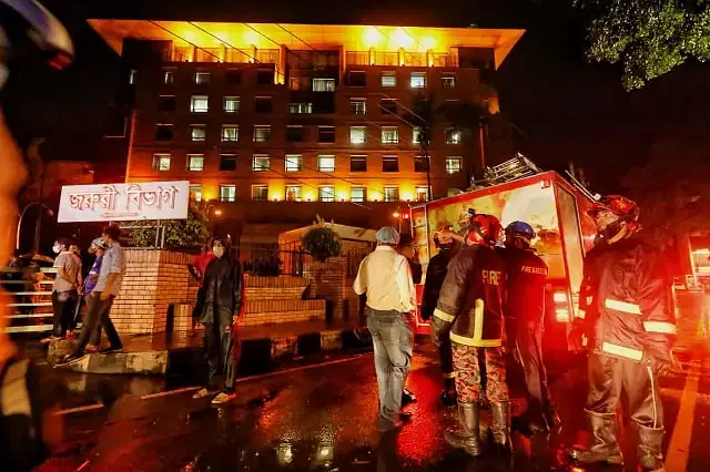 Fire service men work to extinguish fire at United Hospital