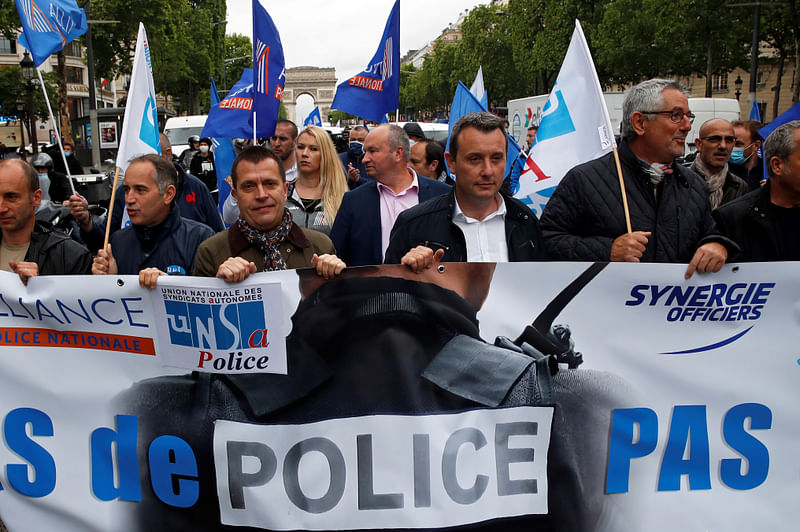 Police officers attend a demonstration against French interior minister Christophe Castaner's reforms, including ditching a controversial chokehold method of arrest, following the death in Minneapolis police custody of George Floyd, near Arc de Triomphe in Paris, France, on 12 June 2020