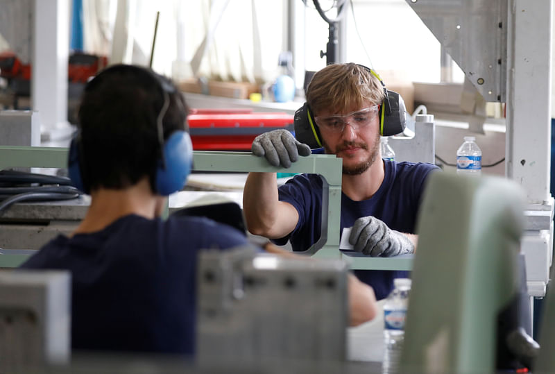 A worker is seen at the Rafaut factory, an equipment supplier to French defense ministry and to civilian aeronautics major primes, at Villeneuve-la-Garenne near Paris, France, 17 June 2020.