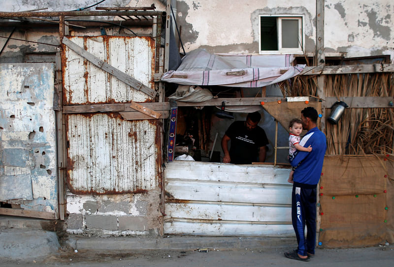 A Palestinian man repairs stoves in a makeshift shop amid the coronavirus disease (COVID-19) crisis, at the Beach refugee camp in Gaza City on 9 June 2020