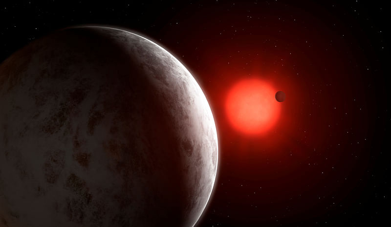 The multiplanetary system of newly discovered super-Earths orbiting nearby red dwarf star Gliese 887 is seen in this artist's impression.