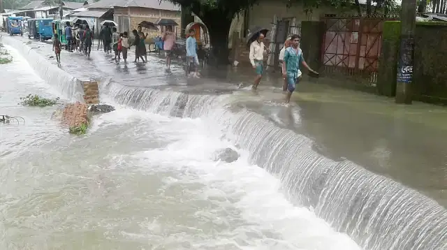 Water of swelling Surma river enters Sunamganj town on Friday (10 July) afternoon