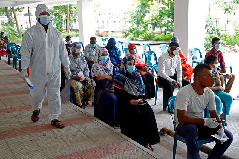 People wait at the coronavirus testing centre of Mugda Medical College and Hospital as COVID-19 continues to spread in Dhaka, Bangladesh, on 2 July 2020