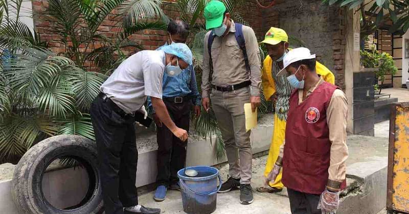 Dhaka North City Corporation men conduct an anti-mosquito drive