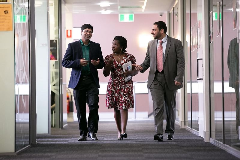 Moazzem Hossain with his colleagues.