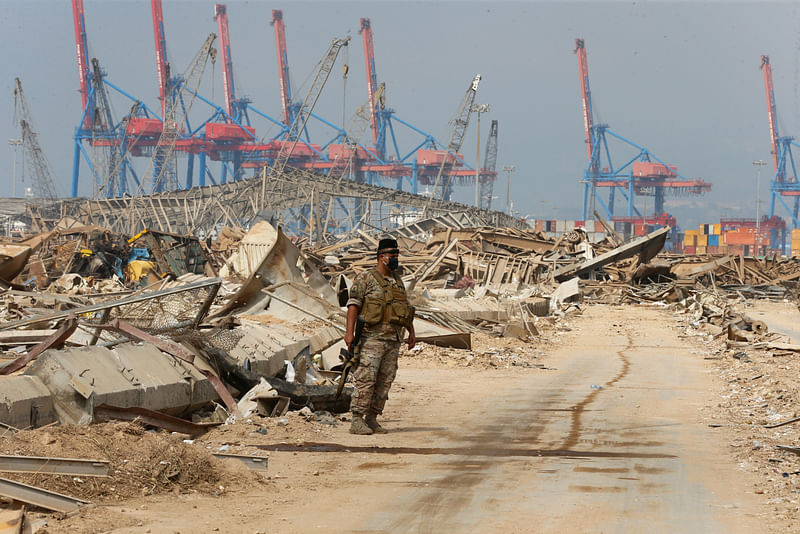 Lebanese army member stands at the site of Tuesday's blast, at Beirut's port area, Lebanon, 7 Augus 2020.