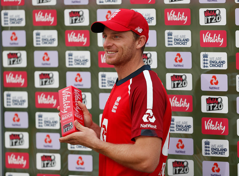 Jos Buttler poses for a photo with his man of the match award after the 2nd T20 against Australia.