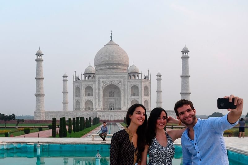 Taj Mahal has been reopened for visitors after six months of closure. Tourists are taking selfie in front of the famous Mughal builiding at India's agra on 20 September.