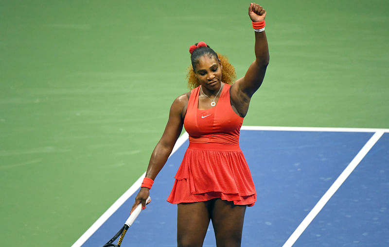 Serena Williams of the United States celebrates at the net following her match against Kristie Ahn of the United States on day two of the 2020 US Open tennis tournament at USTA Billie Jean King National Tennis Center.