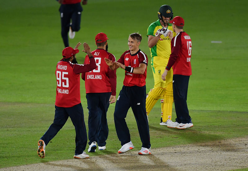 England’s Tom Curran and Adil Rashid celebrate victory in first T20 International against Australia at Ageas Bowl, Southampton, Britain on 4 September 2020