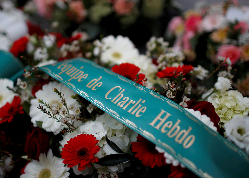 Flowers are seen outside the satirical newspaper Charlie Hebdo's former office on the fifth anniversary of the attack and a siege at a Kosher supermarket which killed 17 people in Paris, France 7 January 2020.