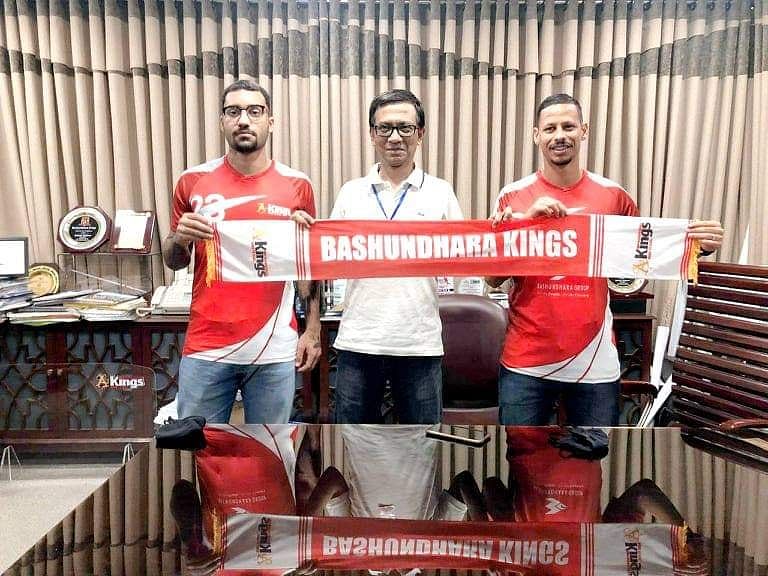 Brazilian footballers, Robinho and Fernandes pose for a photo session with Bashundhara Kings president after signing an agreement