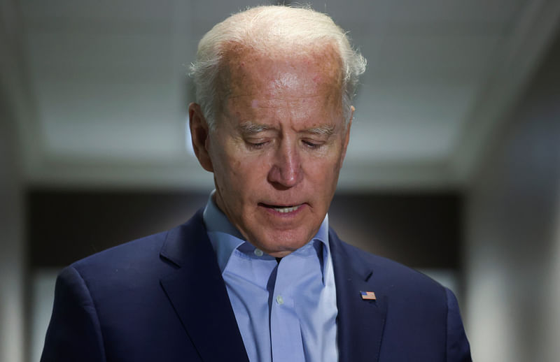 Democratic US presidential nominee and former vice president Joe Biden speaks about the death of US Supreme Court associate justice Ruth Bader Ginsburg shortly after Biden arrived from campaign events in Minnesota at New Castle Airport in New Castle, Delaware, US, on 18 September 2020