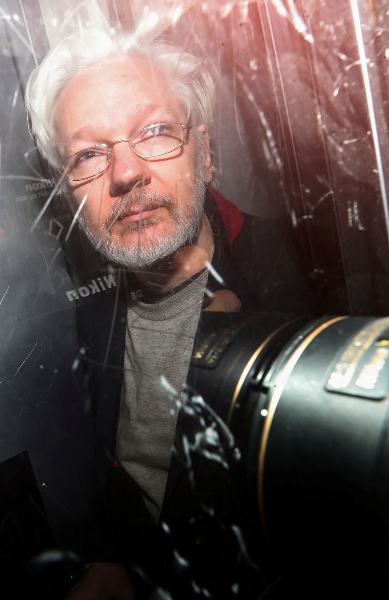 WikiLeaks' founder Julian Assange leaves Westminster Magistrates Court in London, Britain, 13 January 2020.