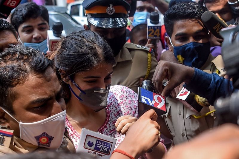 In this file photo taken on 6 September, 2020 Bollywood actress Rhea Chakraborty (C) arrives at the Narcotics Control Bureau (NCB) office in Mumbai. Chakraborty won bail in Mumbai on 7 October