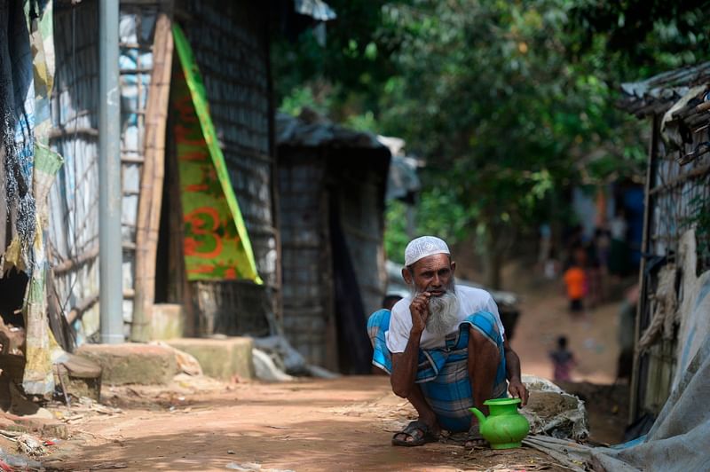 A Rohingya Muslim refugee performs ablution before offering prayer at Kutupalong refugee camp in Ukhia on 13 October 2020.