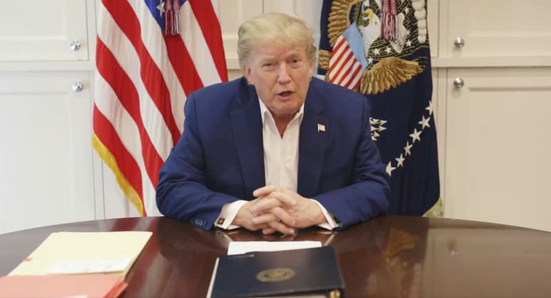 US president Donald Trump, who is being treated for the coronavirus disease in a military hospital outside Washington, speaks from his hospital room, in this still image taken from a video supplied by the White House, on 3 October 2020