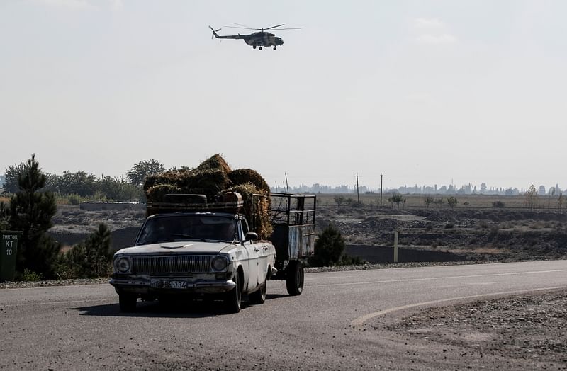 An Azerbaijani military helicopter flies during the fighting over the breakaway region of Nagorno-Karabakh near the city of Terter, Azerbaijan 23 October, 2020.