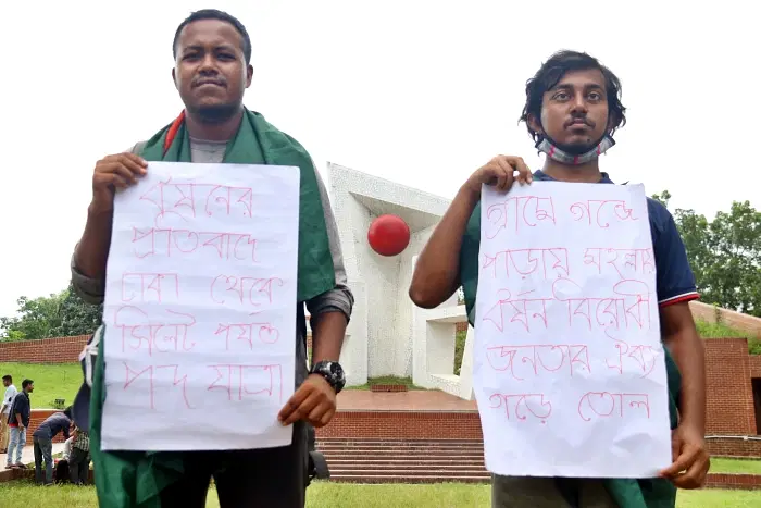 Arif Sohel and Kazi Mehdi Hasan marched from Dhaka to Sylhet in protest against rape. They stand at the Sylhet Central Shaheed Minar on Saturday.