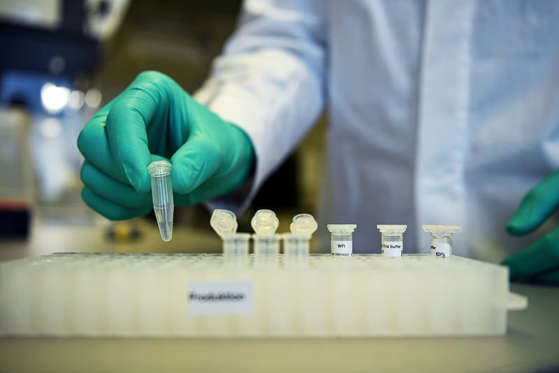 An employee of German biopharmaceutical company CureVac, demonstrates research workflow on a vaccine for the coronavirus (COVID-19) disease at a laboratory in Tuebingen, Germany, on 12 March 2020