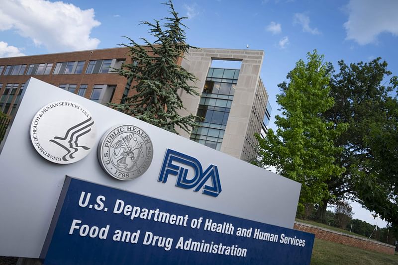 In this file photo taken on 20 July 2020 a sign for the Food And Drug Administration is seen outside of the headquarters in White Oak, Maryland