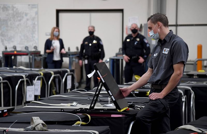 A Clark County election worker checks a voting machine among others that are boxed up at the Clark County Election Department on 6 November 2020 in North Las Vegas, Nevada