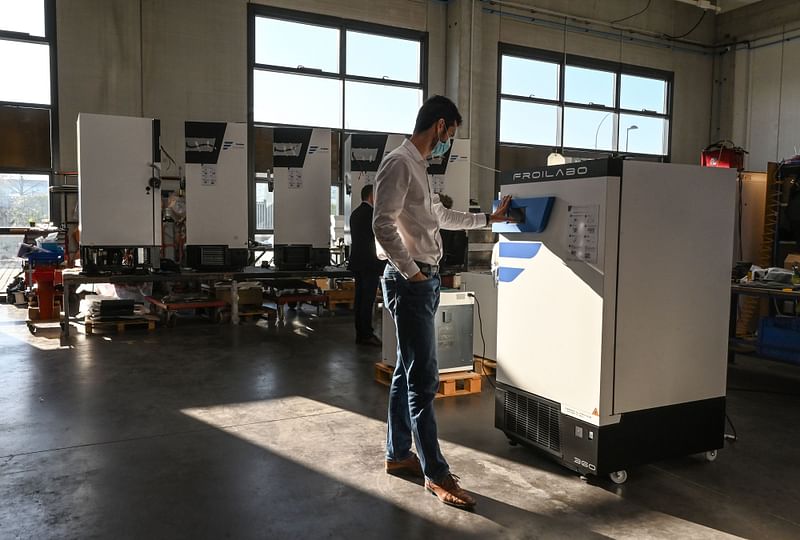 An employee checks a freezer that can store Covid-19 vaccines at the headquarter of Froilabo company in Meyzieu, near Lyon, south-eastern France, on 27 November 2020