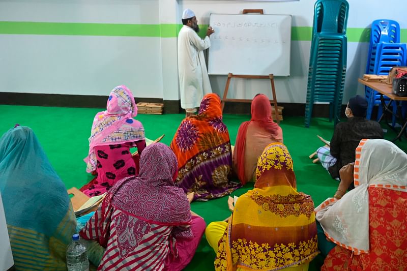 Members of the transgender community learn to read the Holy Quran inside the Dawatul Islam Tritio Linger Madrasa or the Islamic Seminary for the third gender, in Dhaka on 17 November 2020