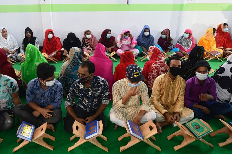 Members of transgender community prepare to read the holy Koran inside the Dawatul Islam Tritio Linger Madrasa or the Islamic Seminary for the third gender, in Dhaka on 6 November 2020