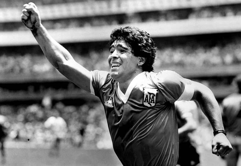 Argentinian star Diego Maradona raises his arm in the air after scoring his game winning goal against England in their World Cup semi final in Mexico, 22 June, 1986.