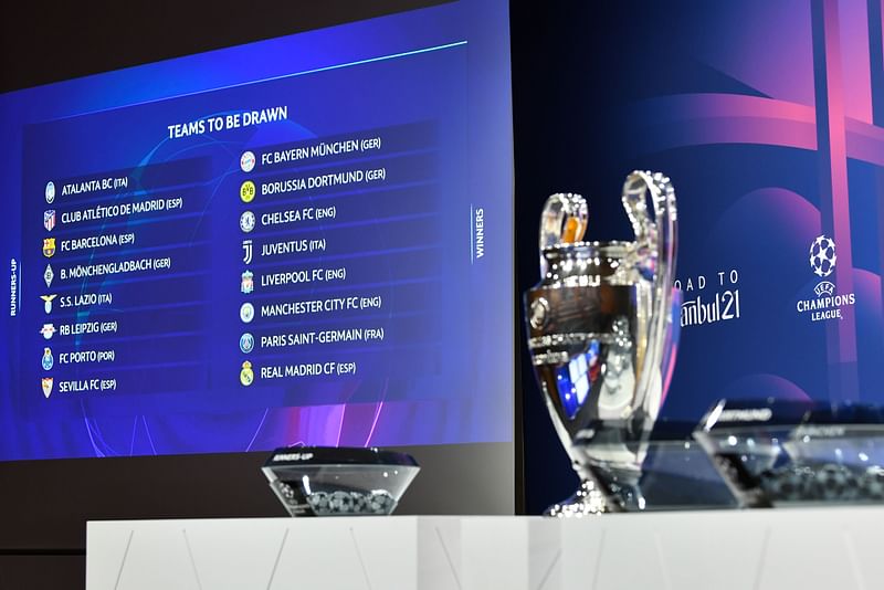 This handout photograph taken and released on 14 December 2020 by the Union of European Football Associations (UEFA) shows the trophy displayed on stage prior to the draw for the round of 16 of the UEFA Champions League football tournament at the UEFA headquarters in Nyon.