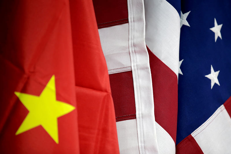 Flags of USA and China are displayed at American International Chamber of Commerce's booth during China International Fair for Trade in Services in Beijing in China on 28 May, 2019