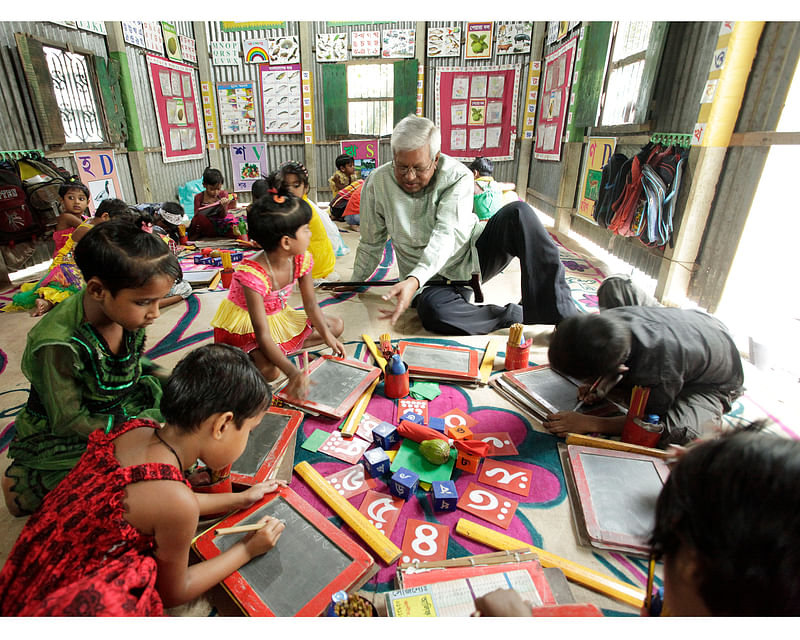 Sir Fazle Hasan Abed amid students of a BRAC school