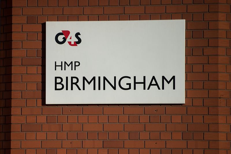 In this file photo taken on 17 December 2016, The sign for "G4S HMP BIRMINGHAM" is pictured at the entrance to HMP Birmingham in Winson Green, Birmingham, central England