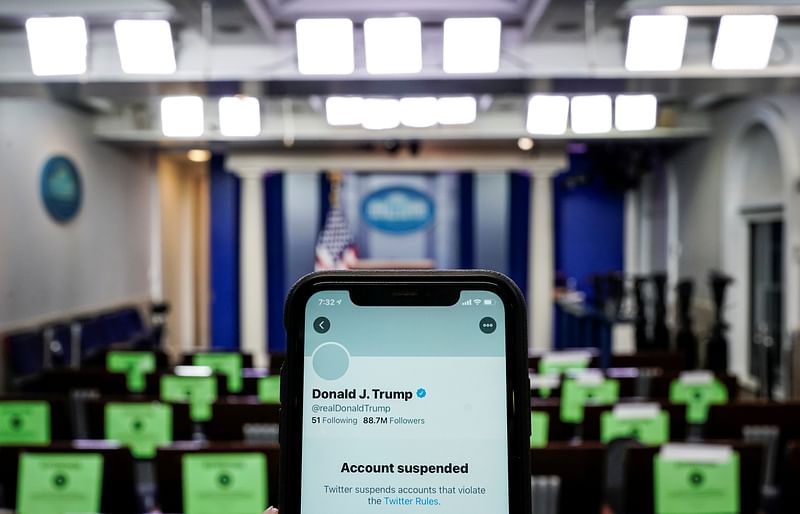 A photo illustration shows the suspended Twitter account of US president Donald Trump on a smartphone at the White House briefing room in Washington, US, on 8 January 2021