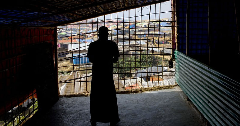 In this 16 January 2018 file photo, a Rohingya Muslim offers afternoon prayers at a make shift Mosque at Kutupalong refugee camp near Cox's bazar, Bangladesh.