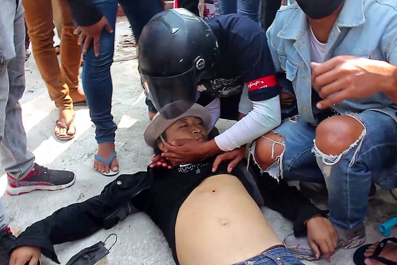 This screengrab from handout video provided to AFPTV from Dawei Watch taken on 28 February, 2021 shows Lwin Lwin Oo after he was shot while taking part in a demonstration against the military coup in Myanmar's southern city of Dawei