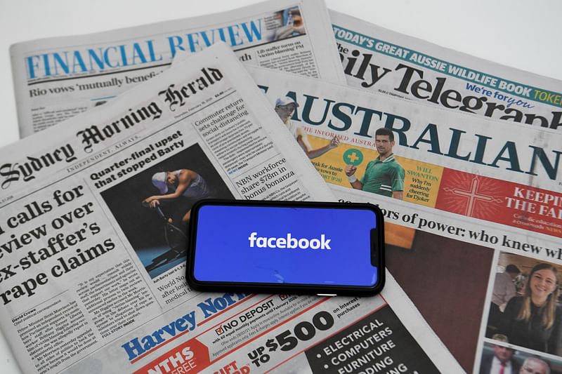 An illustration image shows a phone screen with the "Facebook" logo and Australian newspapers in Canberra, Australia, February 18, 2021