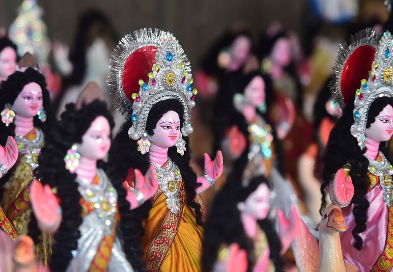 Idols of Goddess Saraswati are displayed for sell ahead of the upcoming Saraswati Puja in Dhaka on 28 January 2020.