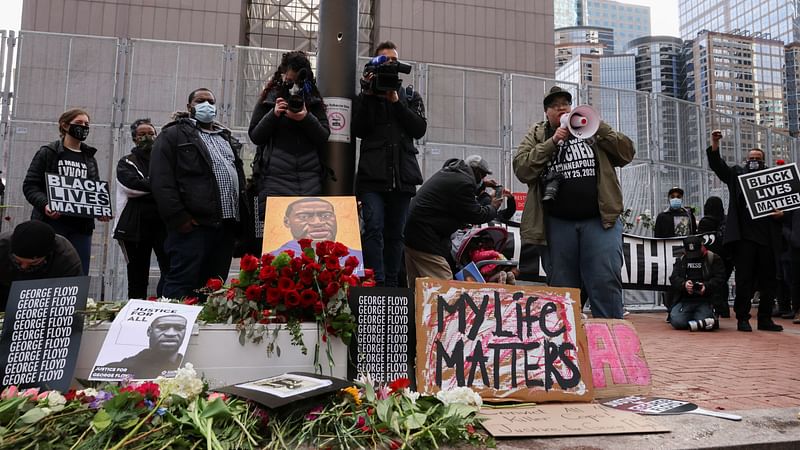 Flowers, placards and images of George Floyd are seen during a rally the day before jury selection is scheduled to begin for the trial of former Minneapolis policeman Derek Chauvin, who is accused of killing George Floyd, in Minneapolis, Minnesota, US on 7 March 2021